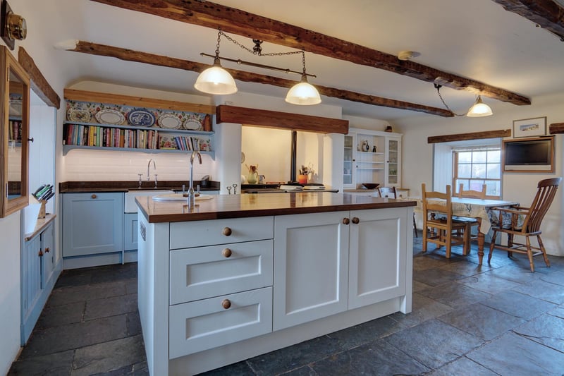 Interior: The accommodation includes a sitting-dining room with wood-burning stove, a snug, family room with timber beams, and a contemporary dining/kitchen with an Aga.range.
