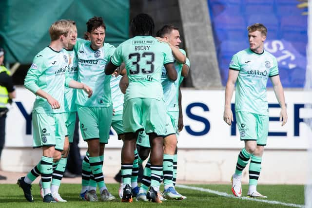 Hibs celebrate their late goal.