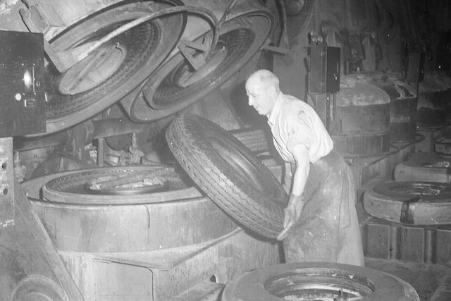 A man working on the manufacture of tyres at the North British factory in 1951.
