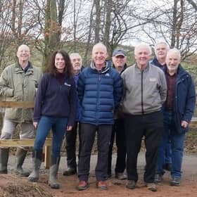 Will Maclean, Chair of the Torphins Paths Group front centre, Dr Susan Cooksley, Manager of the Dee Catchment Partnership front left, Bert McIntosh, McIntosh Plant Hire (Abdn) Ltd front right, with TPG Volunteers behind, celebrate the newly-opened path by the Easter Beltie burn.