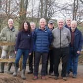 Will Maclean, Chair of the Torphins Paths Group front centre, Dr Susan Cooksley, Manager of the Dee Catchment Partnership front left, Bert McIntosh, McIntosh Plant Hire (Abdn) Ltd front right, with TPG Volunteers behind, celebrate the newly-opened path by the Easter Beltie burn.