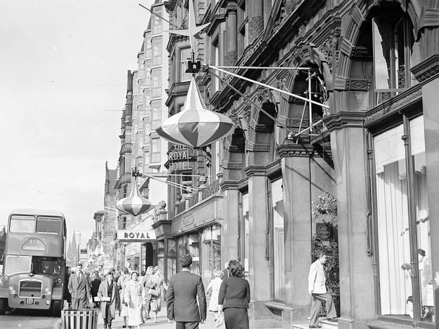 Here, you can see lantern style Edinburgh Festival decorations that have been hung up outside of Jenners on Princes Street. Year: 1957