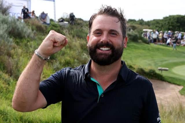 Matthew Baldwin shows what it means to win for the first time on the DP World Tour, having made his breakthrough in the SDC Championship St Francis Links in South Africa on Sunday. Picture: Warren Little/Getty Images.