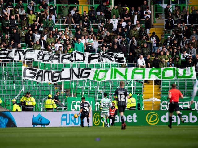 Celtic fans are known for having a pop at the board through banners at matches