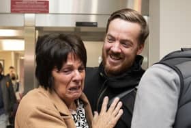 Scottish construction engineer Brian Glendinning with his mother Meta Glendinning after arriving at Edinburgh Airport