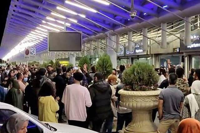 People gather at Imam Khomeini International Airport in Tehran to welcome Elnaz Rekabi, an Iranian climber who caused a sensation by competing at an event abroad without a hijab Photo by -/AFP via Getty Images