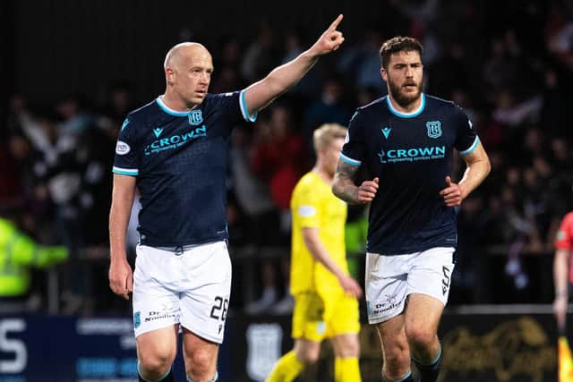 Charlie Adam celebrates after scoring to make it 3-1 to Dundee against Hibs.