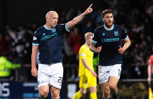 Charlie Adam celebrates after scoring to make it 3-1 to Dundee against Hibs.