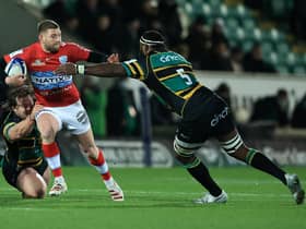 Finn Russell of Racing 92 is tackled by Api Ratuniyarawa (R) and Nick Auterac during the Heineken Champions Cup win over Northampton Saints. (Photo by David Rogers/Getty Images)