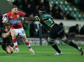 Finn Russell of Racing 92 is tackled by Api Ratuniyarawa (R) and Nick Auterac during the Heineken Champions Cup win over Northampton Saints. (Photo by David Rogers/Getty Images)