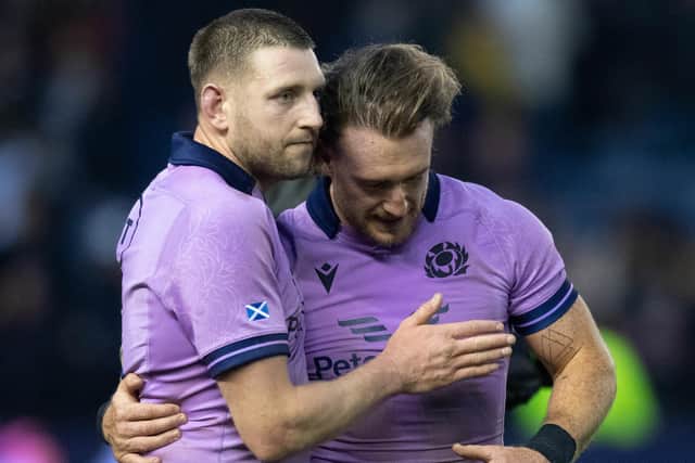Finn Russell consoles Stuart Hogg at the end of the game. (Photo by Ross Parker / SNS Group)