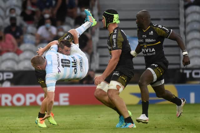 Finn Russell is upended playing for Racing 92 against La Rochelle in the French Top 14 semi-final. He has now joined up with the Lions.
