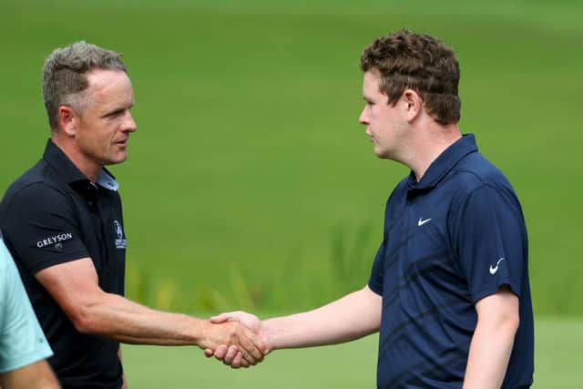 Luke Donald shakes hands with Bob MacIntyre after they played in the same group in the BMW PGA Championship at Wentworth in September. Picture: Andrew Redington/Getty Images.