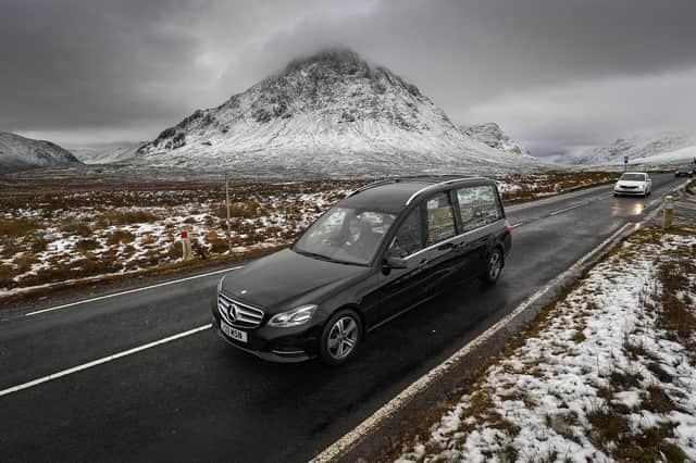 The funeral cortege of Dr Hamish MacInnes makes its way past Buachaille Etive Mor in Glencoe (Picture: Jeff J Mitchell/Getty Images)