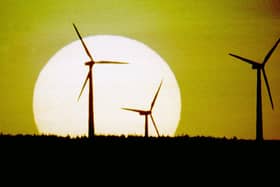 The sun sets behind Scotland's first wind farm on Hagshaw Hill near Douglas in Lanarkshire. The 26 turbine first produced electricity in 1995 and was extended to 46 turbines in 2008. It is operated by ScottishPower Renewables.