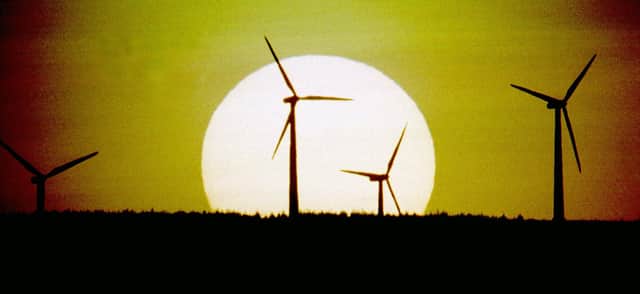 The sun sets behind Scotland's first wind farm on Hagshaw Hill near Douglas in Lanarkshire. The 26 turbine first produced electricity in 1995 and was extended to 46 turbines in 2008. It is operated by ScottishPower Renewables.