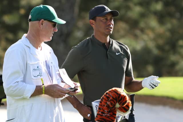 Tiger Woods talks tactics with caddie Joe LaCava during the first round of the Masters at Augusta National Golf Club. Picture: Jamie Squire/Getty Images