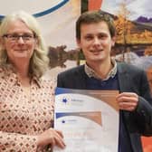 Chair of the Cairngorms Tourism Partnership, Xander McDade receives the award in Brussels