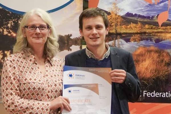 Chair of the Cairngorms Tourism Partnership, Xander McDade receives the award in Brussels