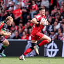 Toulouse full-back Blair Kinghorn escapes from Harlequins' Louis Lynagh during the Investec Champions Cup Semi-Final at Le Stadium in Toulouse.  (Photo by Dan Sheridan/INPHO/Shutterstock)