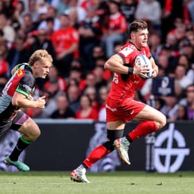 Toulouse full-back Blair Kinghorn escapes from Harlequins' Louis Lynagh during the Investec Champions Cup Semi-Final at Le Stadium in Toulouse.  (Photo by Dan Sheridan/INPHO/Shutterstock)