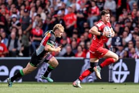 Toulouse full-back Blair Kinghorn escapes from Harlequins' Louis Lynagh during the Investec Champions Cup Semi-Final at Le Stadium in Toulouse.  (Photo by Dan Sheridan/INPHO/Shutterstock)