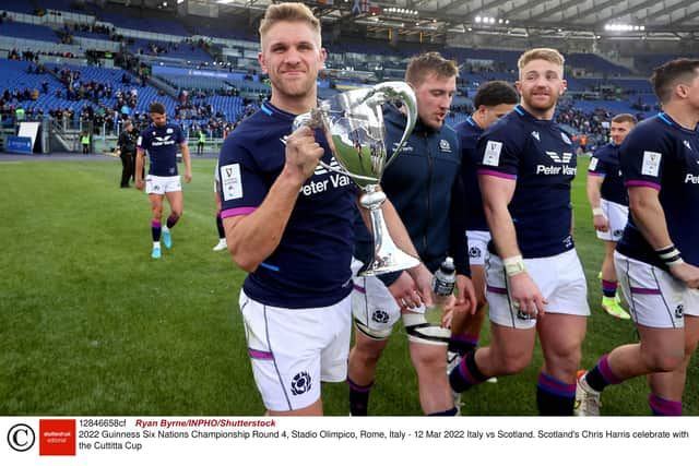 Chris Harris celebrates with the Cuttitta Cup after Scotland's 33-22 win at the Stadio Olimpico. Photo by Ryan Byrne/INPHO/Shutterstock