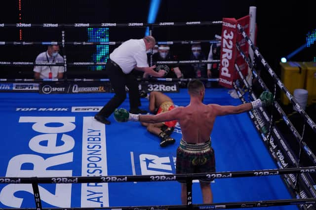 Josh Taylor celebrates his first-round win over Thailand's Apinun Khongsong.