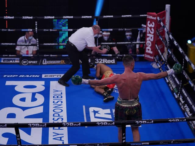 Josh Taylor celebrates his first-round win over Thailand's Apinun Khongsong.