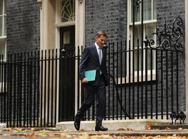 Jeremy Hunt leaves Downing Street to present his autumn statement to the House of Commons (Picture: Dan Kitwood/Getty Images)
