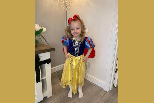 Stay away from the apple! Mila, aged 3, was the fairest of them all as Snow White.