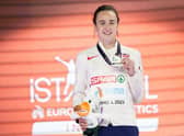 Laura Muir, of Great Britain, poses with her gold medal on the podium of the Women 1500 meters at the European Athletics Indoor Championships at Atakoy Arena in Istanbul, Turkey, Saturday, March 4, 2023. (AP Photo/Francisco Seco)