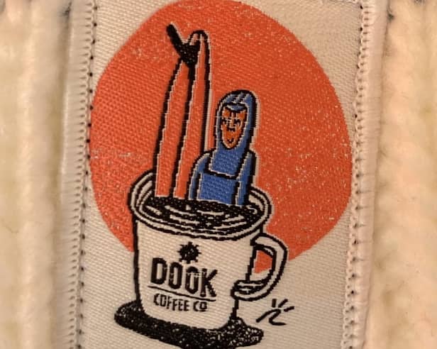 The surf-inspired logo of the Dook Cafe, West Sands, St Andrews