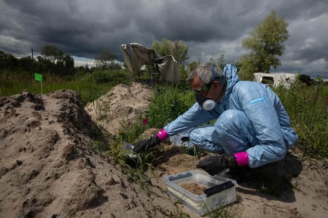 Greenpeace investigators extract earth samples to check for disturbed radiation in the Chernobyl nuclear plant exclusion zone, where trenches were dug and defensive structures built by the Russian military during their occupation of the site in March 2022. Picture: Jeremy Sutton-Hibbert/Greenpeace