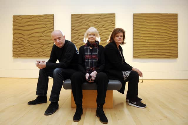 Joan Hills with children and fellow artists Sebastian Boyle and Georgia Boyle with their work Sand, Wind and Tide at the Scottish National Gallery of Modern Art in 2013 (Picture: Greg Macvean)
