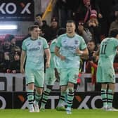 Hibs players complain to referee David Munro about the penalty decision the led to Aberdeen's opener. (Photo by Craig Foy / SNS Group)