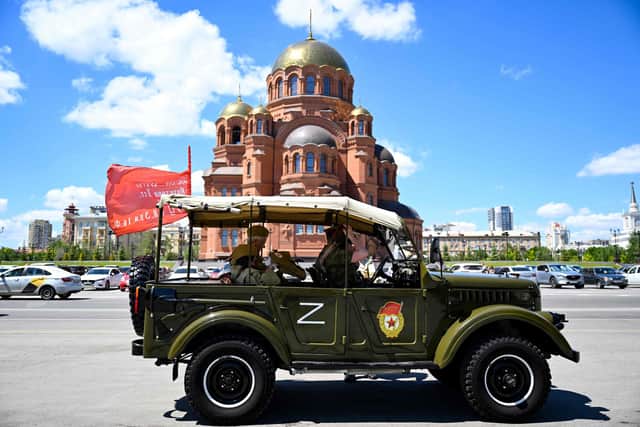 Tourists wearing World War Two-era styled outfits take a city tour in a historical military vehicle adorned with the letter Z, which has become a symbol of support for Russian military action in Ukraine, in the southern city of Volgograd. Picture: Kirill Kudyavtsev/AFP via Getty Images