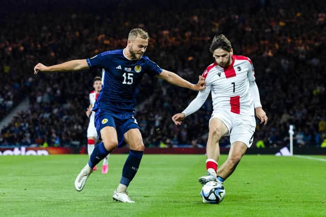 Scotland defender Ryan Porteous challenges Georgia's Khvicha Kvaratskhelia during the Euro 2024 qualifier at Hampden in June. (Photo by Craig Foy / SNS Group)