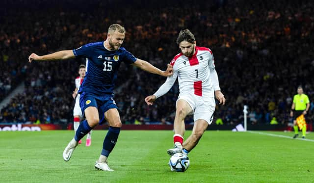 Scotland defender Ryan Porteous challenges Georgia's Khvicha Kvaratskhelia during the Euro 2024 qualifier at Hampden in June. (Photo by Craig Foy / SNS Group)