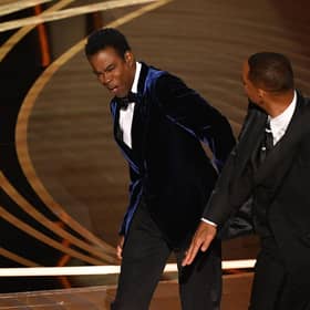 Actor Will Smith (R) slaps US actor Chris Rock onstage during the 94th Oscars at the Dolby Theatre in Hollywood, California