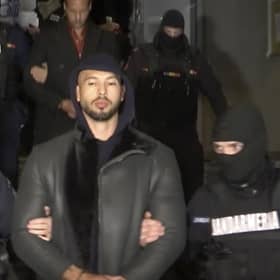 Andrew Tate is led away by police from an address in Ilfov, north of Bucharest, Romania (Picture: Observator Antena 1 via AP)