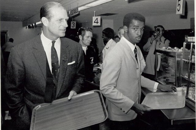 HRH Prince Philip with Jamaican athlete Don Quarrie in the Commonwealth Games dining room.