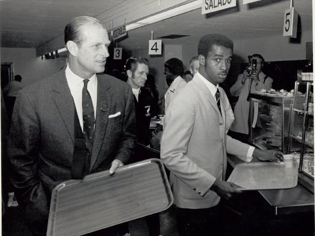 HRH Prince Philip with Jamaican athlete Don Quarrie in the Commonwealth Games dining room.