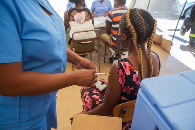 A woman is vaccinated against Covid in Harare, Zimbabwe, but many in the world's poorest countries are not so fortunate (Picture: Tafadzwa Ufumeli/Getty Images)