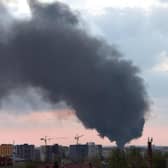 Dark smoke rises following an air strike in the western Ukrainian city of Lviv, on May 3, 2022. Photo by Yuriy Dyachyshyn / AFP