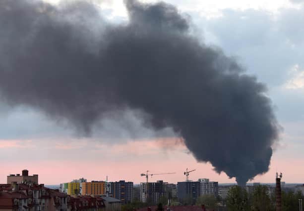 Dark smoke rises following an air strike in the western Ukrainian city of Lviv, on May 3, 2022. Photo by Yuriy Dyachyshyn / AFP