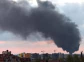 Dark smoke rises following an air strike in the western Ukrainian city of Lviv, on May 3, 2022. Photo by Yuriy Dyachyshyn / AFP