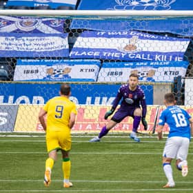 Kevin Nisbet sends Danny Rogers the wrong way to put Hibs ahead.