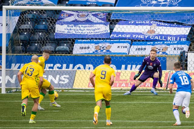 Kevin Nisbet sends Danny Rogers the wrong way to put Hibs ahead.