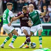 Hearts midfielder Jorge Grant challenged by Hibs duo Josh Campbell (left) and Elias Melkersen.  (Photo by Alan Harvey / SNS Group)